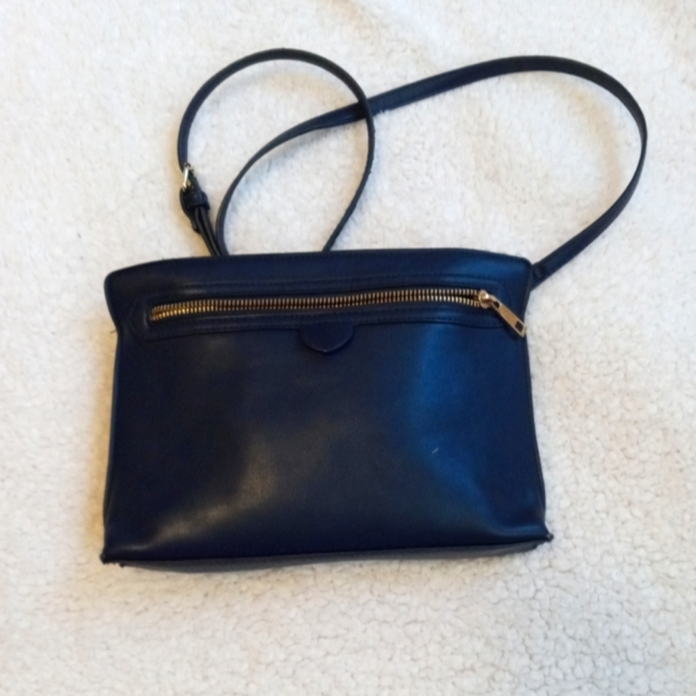 Medium size blue purse with gold detail.